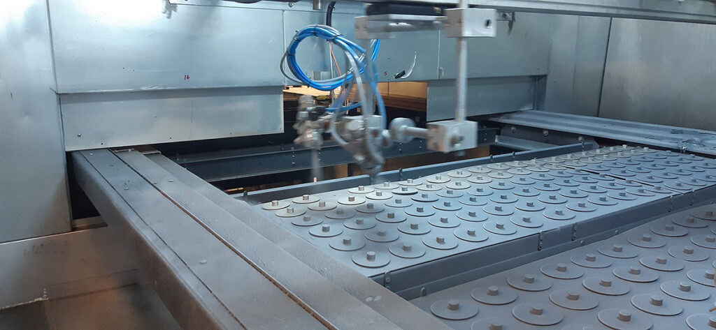 Flat bed chemosil spray paint application to vibration dampers